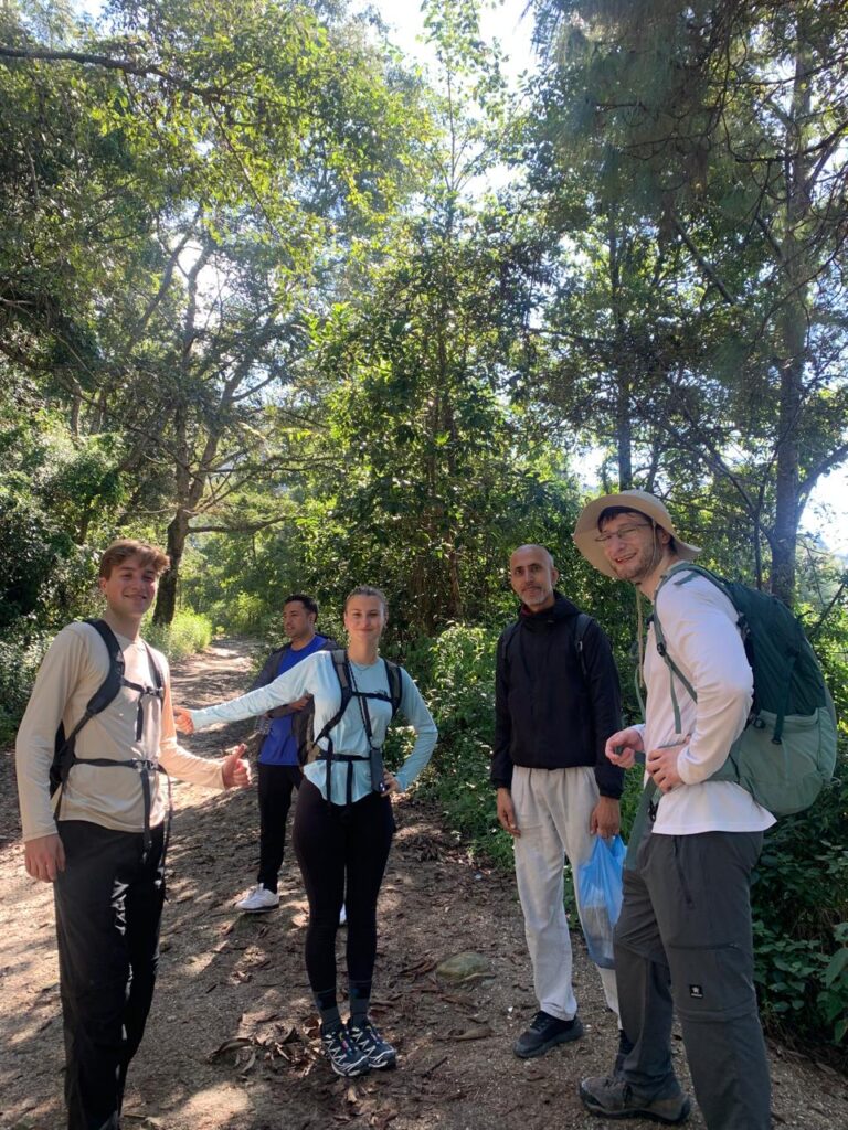 Group walking through Shivapuri National Park on a wellness day hike.