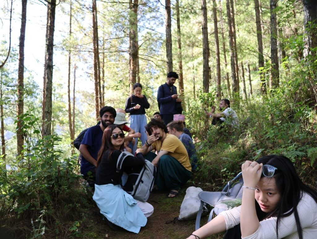 Hikers taking a relaxing break in the jungle while enjoying the natural surroundings.